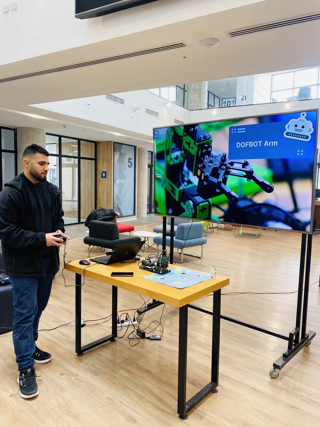 Hands-on AI and Robotics workshop at Palestine Technopark featuring the DOFBOT AI Vision Robotic Arm.